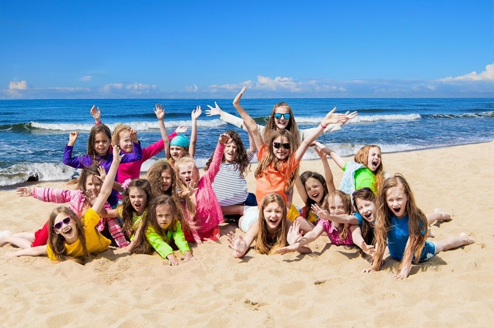 Group of happy children on the beach